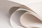 Abstract image of overlapping paper layers in neutral tones with soft shadows